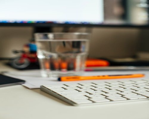 home workspace with water on the desk